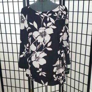 NWT long-sleeve top perfect for those black pants you keep on rotation! Large